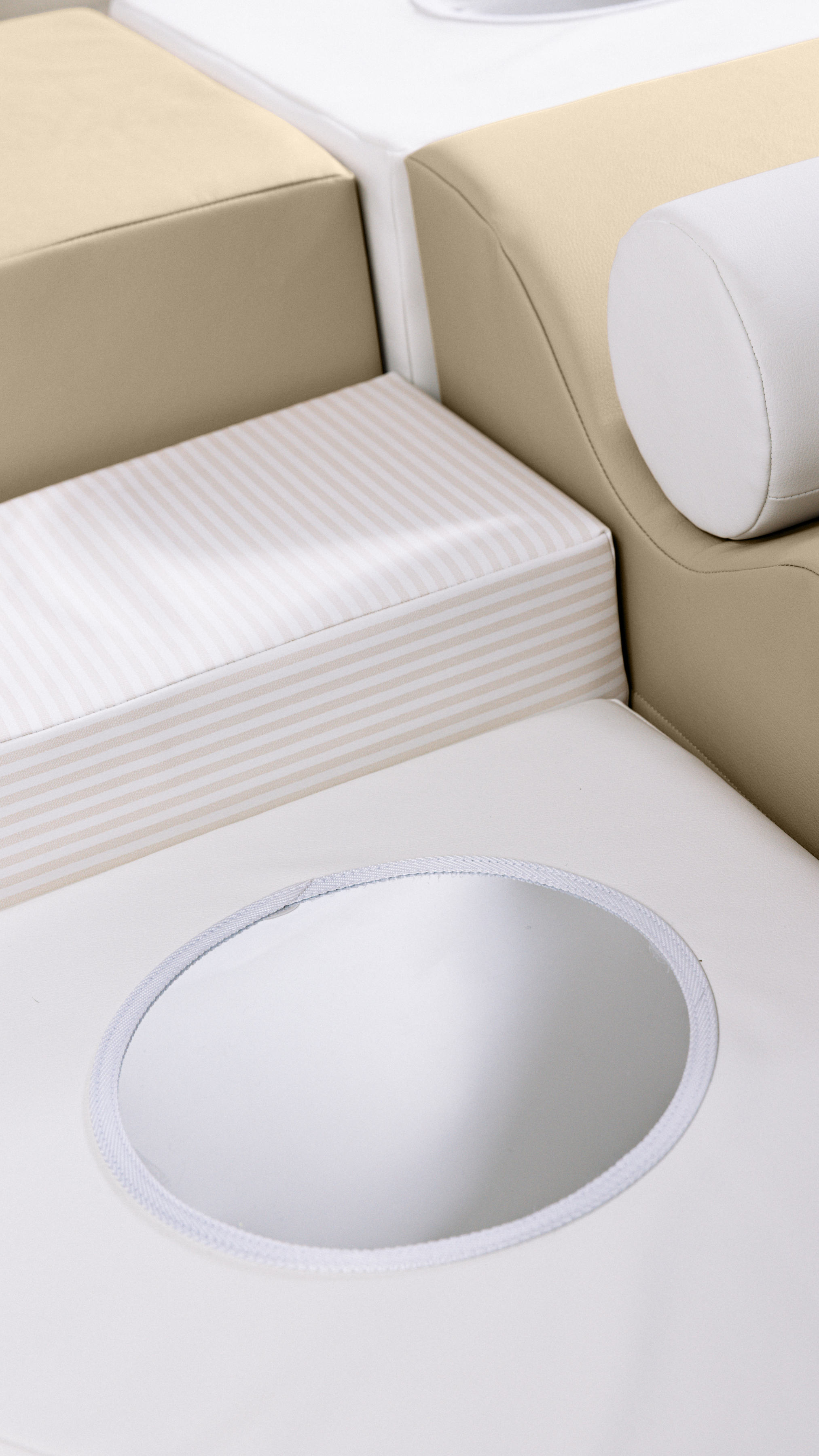 Close-up of a car seat with beige and white colors